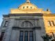 Detailed view of the historic Williamsburgh Savings Bank in Brooklyn, New York, captured at sunset.