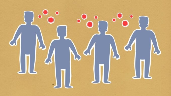 Paper cutout silhouette of men placed together surrounded by contagious spreading red viruses on brown background during dangerous coronavirus outbreak