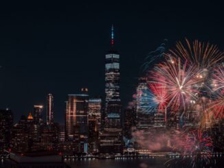 Colorful fireworks illuminating the New York City skyline at night, capturing a vibrant celebration.