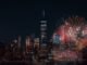 Colorful fireworks illuminating the New York City skyline at night, capturing a vibrant celebration.